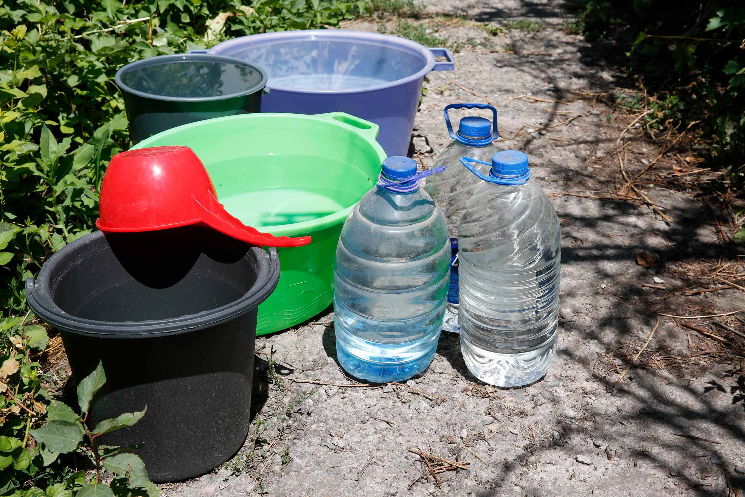 Residents in Bishkek have been piling water bottles as water shortages have hit Kyrgyzstan's capital amid soaring temperatures. Experts maintain that while climate change aggravates water problems in the central Asian country, the underlying problem is poor management. © IWPR Central Asia