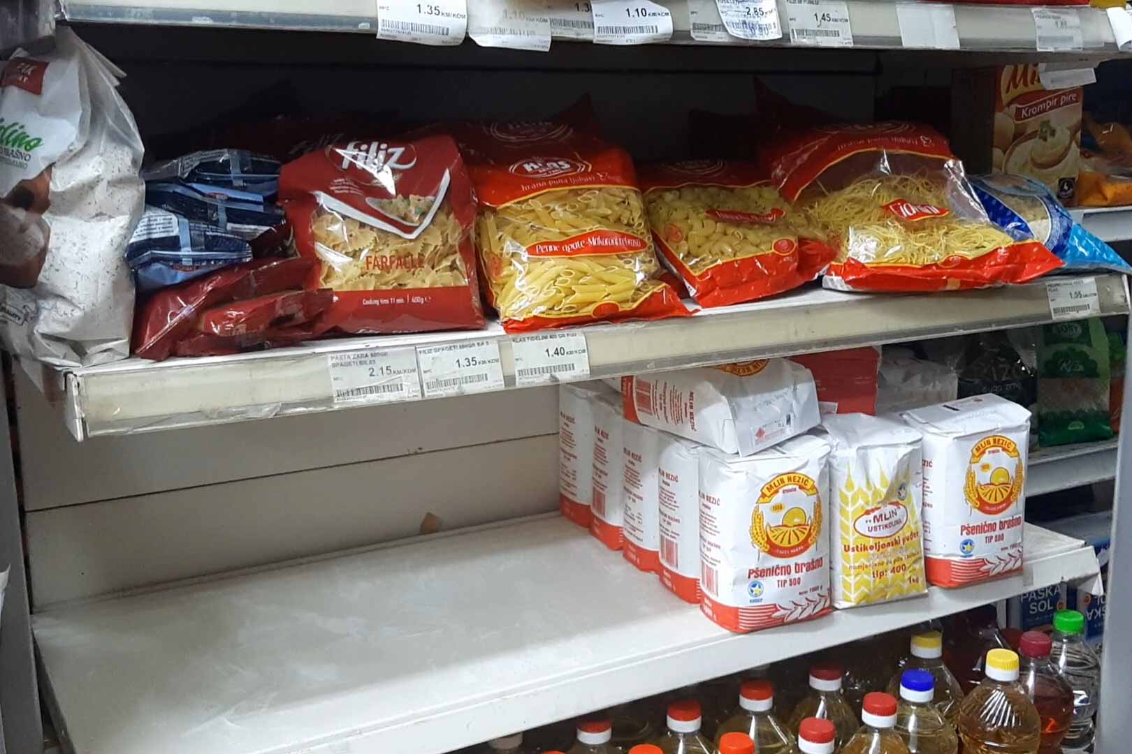 Half-empty shelves in a Sarajevo grocery store with flour in high demand. © Marija Arnautović