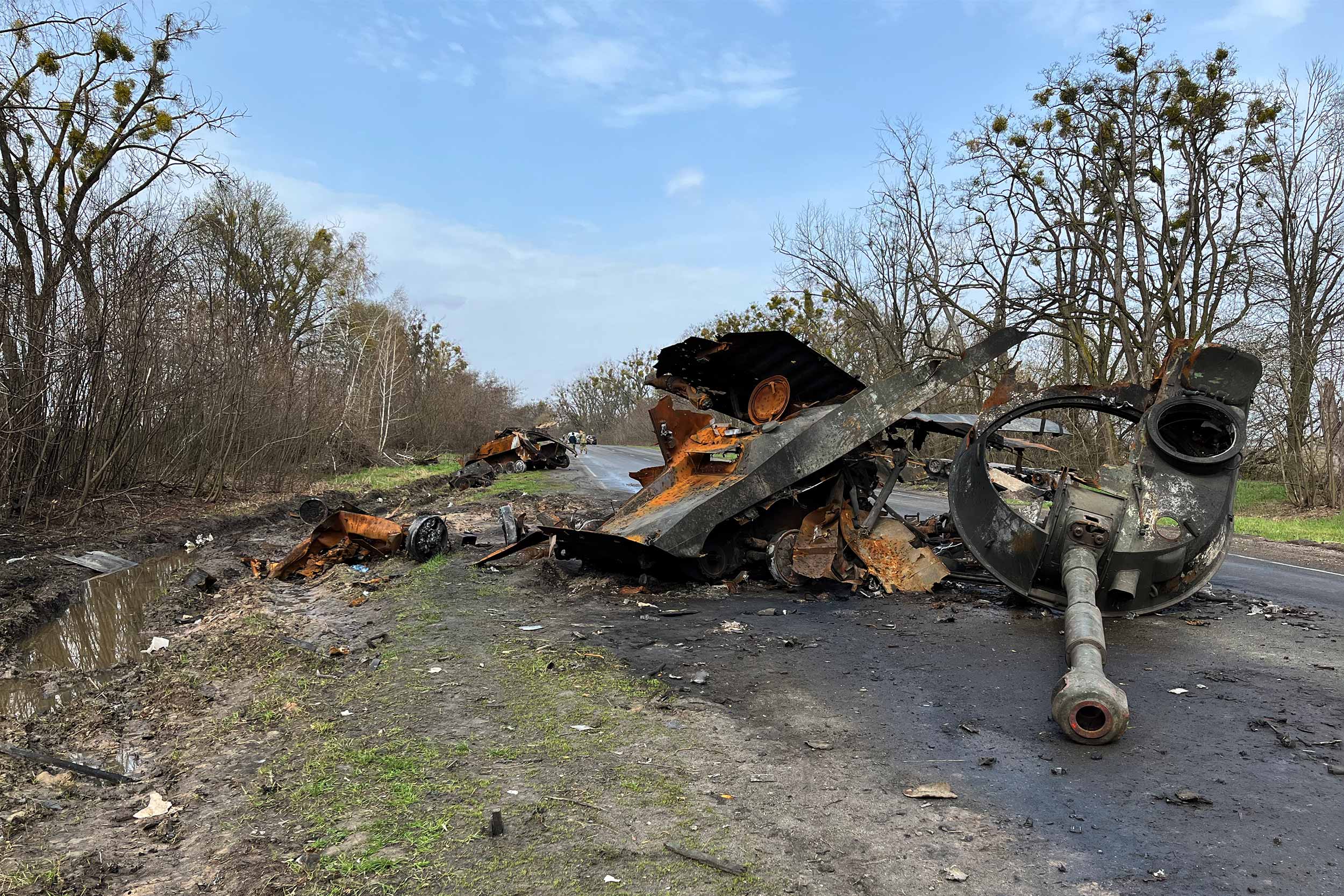 Destroyed military equipment scattered across the road on the drive from Kyiv. © IWPR