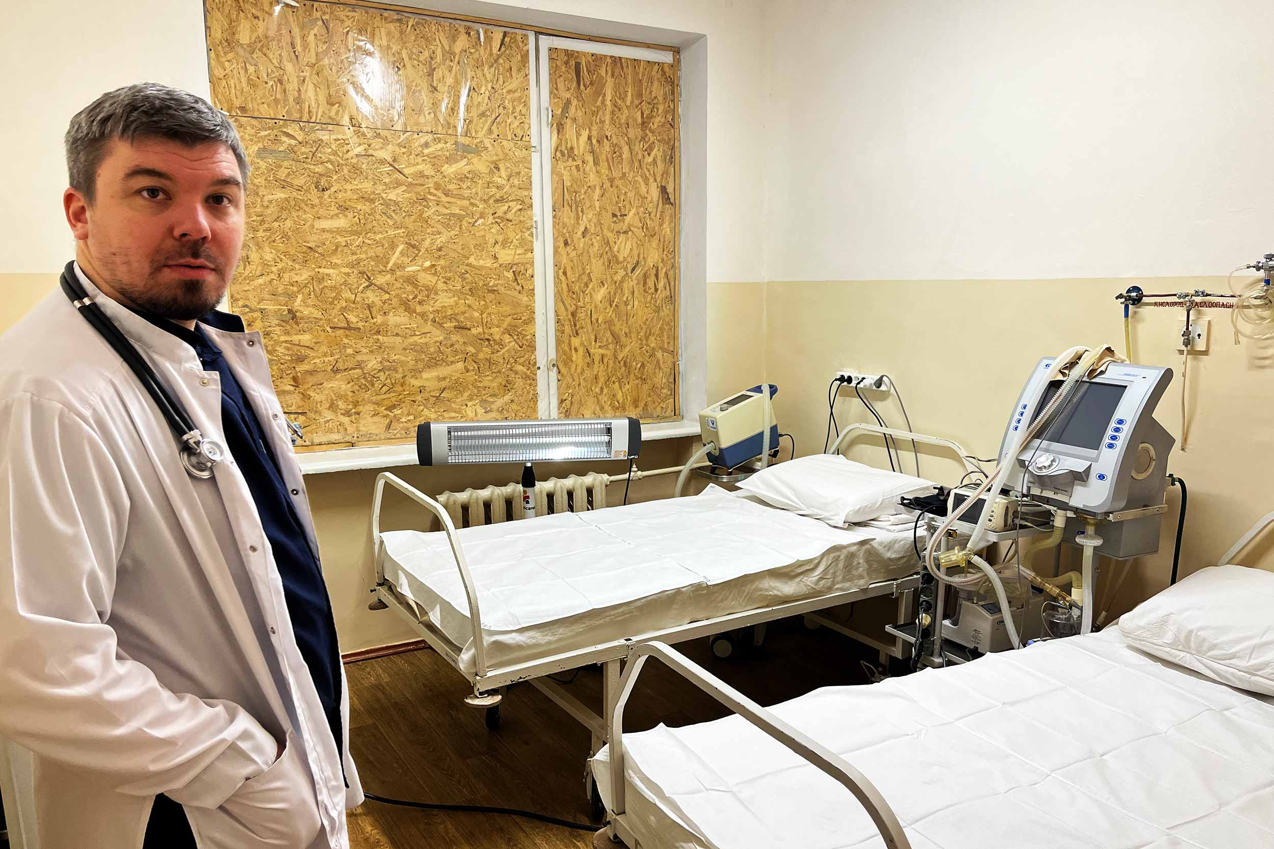 Stanislav Bumbu, a doctor at the Kherson Children's Hospital where on December 31, while a toddler boy was receiving an emergency blood infusion, a shell struck the room just next door. The windows were blown out and are now blocked off. © Anthony Borden/IWPR